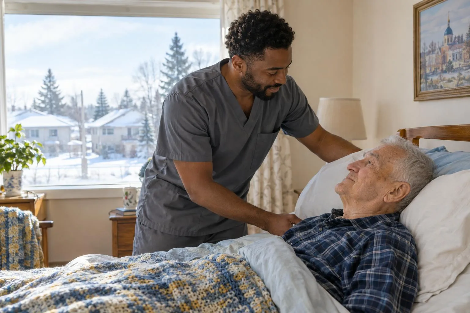 A caregiver adjusts pillows for an older man resting in bed by a window.